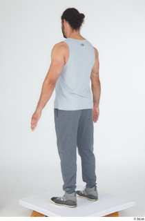 Simeon dressed grey joggers grey sneakers grey tank top sports…